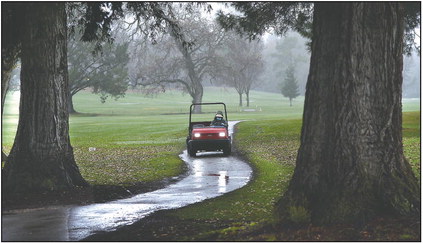 Rain closes soggy golf course – but brings needed drought relief